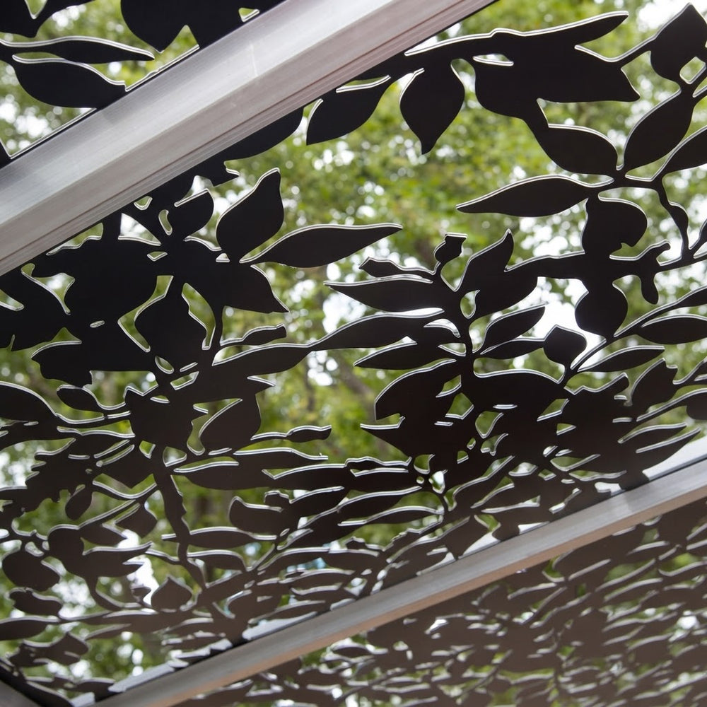 Decorative outdoor privacy panel with detailed botanical vine design