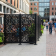Powder coated metal privacy screen with classic ornamental scroll design