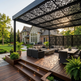 Decorative outdoor privacy partition with elegant scroll pattern cutouts