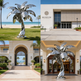 Abstract metal palm tree artwork featuring reflective surfaces and stylized leaf forms
