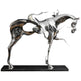 Futuristic metal horse artwork with smooth mirrored surfaces and an abstract rider form