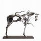 Metallic horse sculpture on a white background