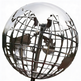 Polished metal globe sculpture with raised continents and a reflective latitude‑longitude grid