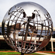 Metallic globe artwork with polished surfaces and stylized geographic continent pieces