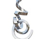 Polished metallic ribbon‑form sculpture featuring intertwined looping curves and reflective surfaces