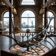 Polished metal structure combining curved vertical shapes into a modern nautical‑inspired design
