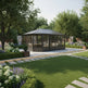 Garden pavilion in a lush green garden with trees and flowers.