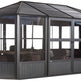 Modern enclosed outdoor pavilion with pitched roof and clear wall panels