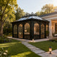 Luxury outdoor pavilion with arched glass roof and wrought iron design