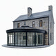 Stone house with a modern glass extension on a white background