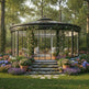 Orchard-style glasshouse with floral decorations in a garden setting