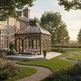 Luxury estate conservatory surrounded by flowers and greenery