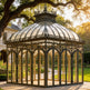 Decorative wrought iron conservatory with crown roof cresting