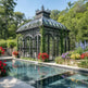 Premium outdoor glass pavilion in landscaped garden setting