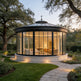 Glass‑walled outdoor pavilion with conical roof design