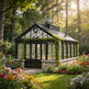 Orchard greenhouse with floral garden and trees in the background