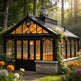 Orchard house with glass facade and stone base in a garden setting
