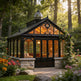 Orchard house with glass roof and stone foundation surrounded by flowers and trees