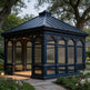 Dark blue gazebo with lattice design in a garden setting