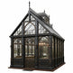 Gothic-style glasshouse with intricate metalwork on a white background