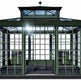 Modern glass conservatory with raised roof and steel framing