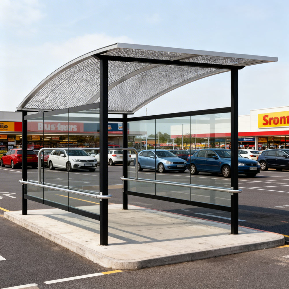 Side profile of modern shopping cart shelter featuring transparent glass panels and black steel supports.