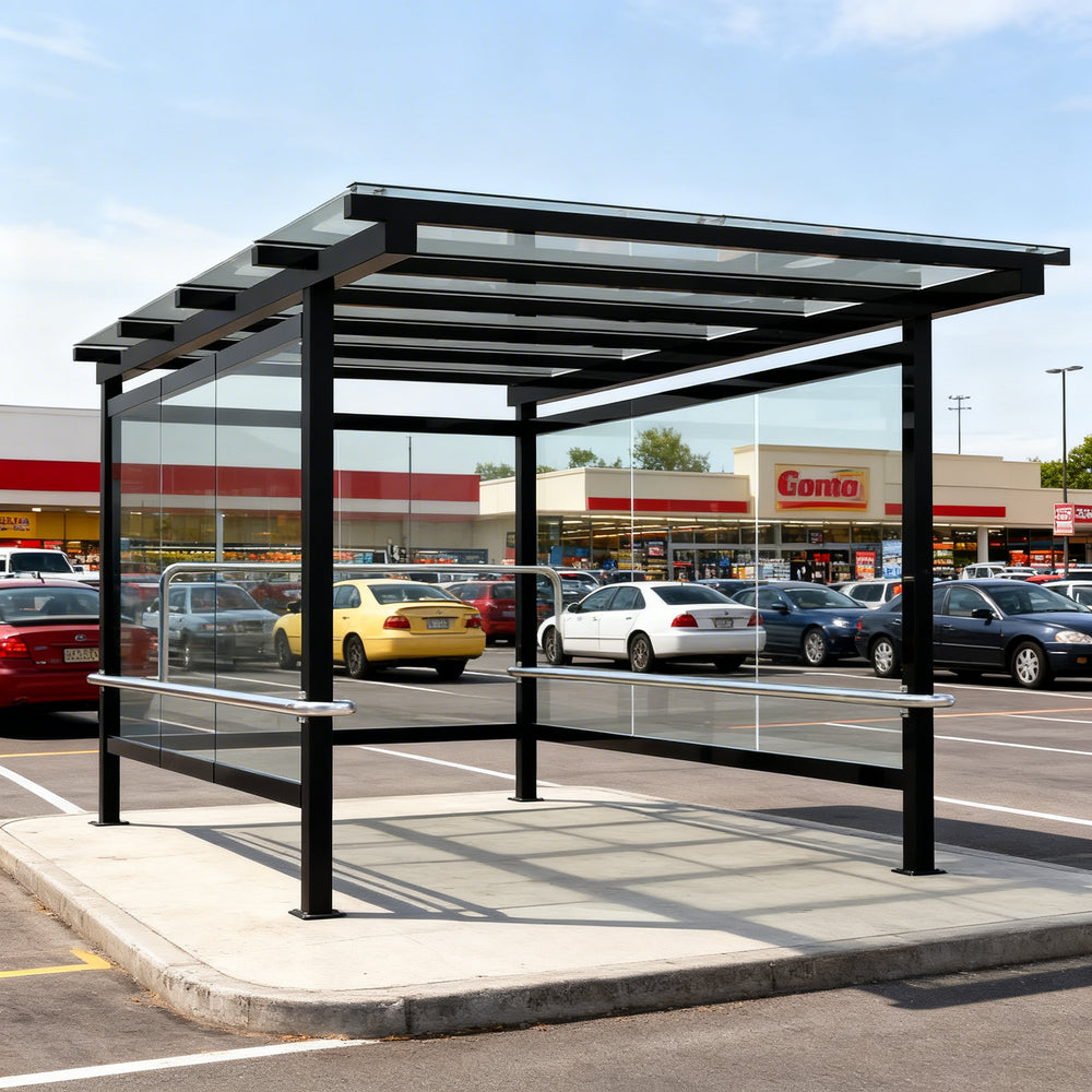 Rear angle of modern shopping cart shelter with clear side panels and open front entry.