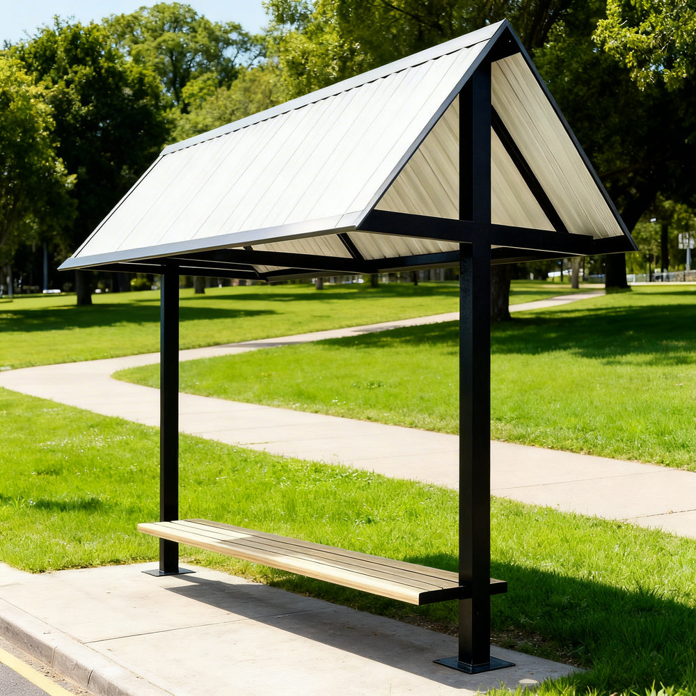 Rear angle of modern outdoor bench shelter with pitched roof and open‑air design.