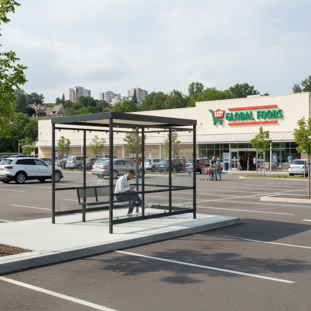 TAIMCO shopping cart shelter installed outdoors with flat roof and glass side panels for retail cart storage.