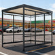 Side profile of modern shopping cart shelter featuring flat roof design and transparent glass enclosure.