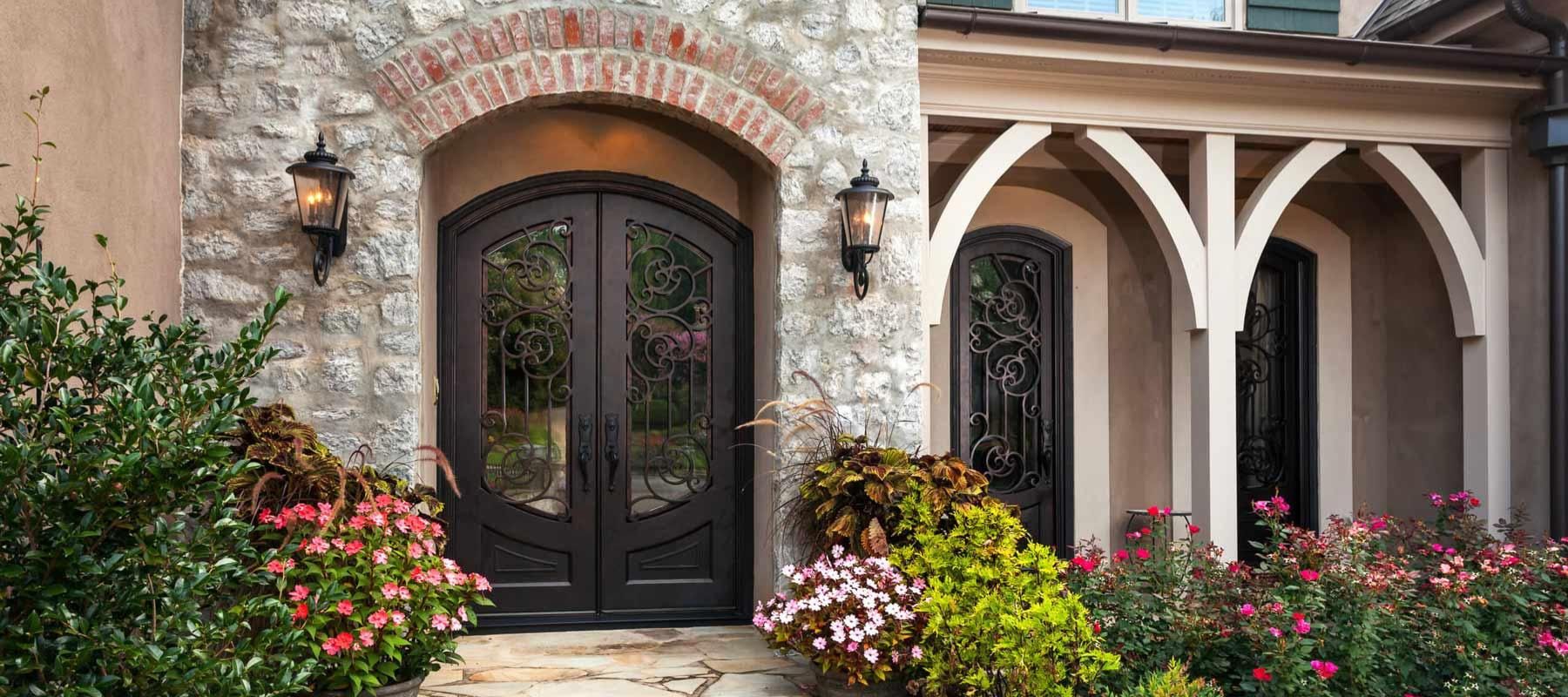 Elegant Black Iron door in front of vintage house in Canada