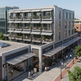 Multi-story building with commercial establishments on a city street