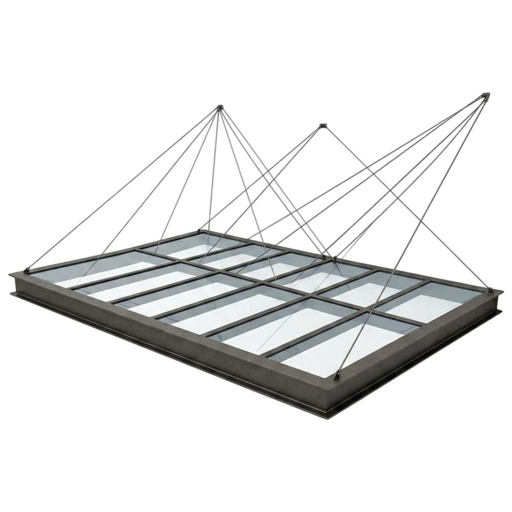 Glass roof panel with metal frame on a white background