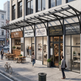 Commercial building with various businesses including a restaurant and co-working offices.