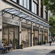 Row of shops with glass facades on a city street