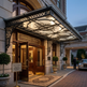 Luxury hotel entrance with decorative canopy and classical architecture