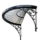 Semi‑circular fan‑style wrought iron canopy with glass roof above entrance.