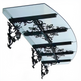 Curved glass outdoor awning with floral wrought iron scrollwork and dual lanterns.
