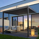 Outdoor patio with pergola, furniture, and modern house exterior