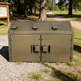 Green metal trash bin with 'Taimco' branding in a park setting