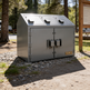 Metal trash bin with three compartments in a park setting, featuring the Taimco brand.