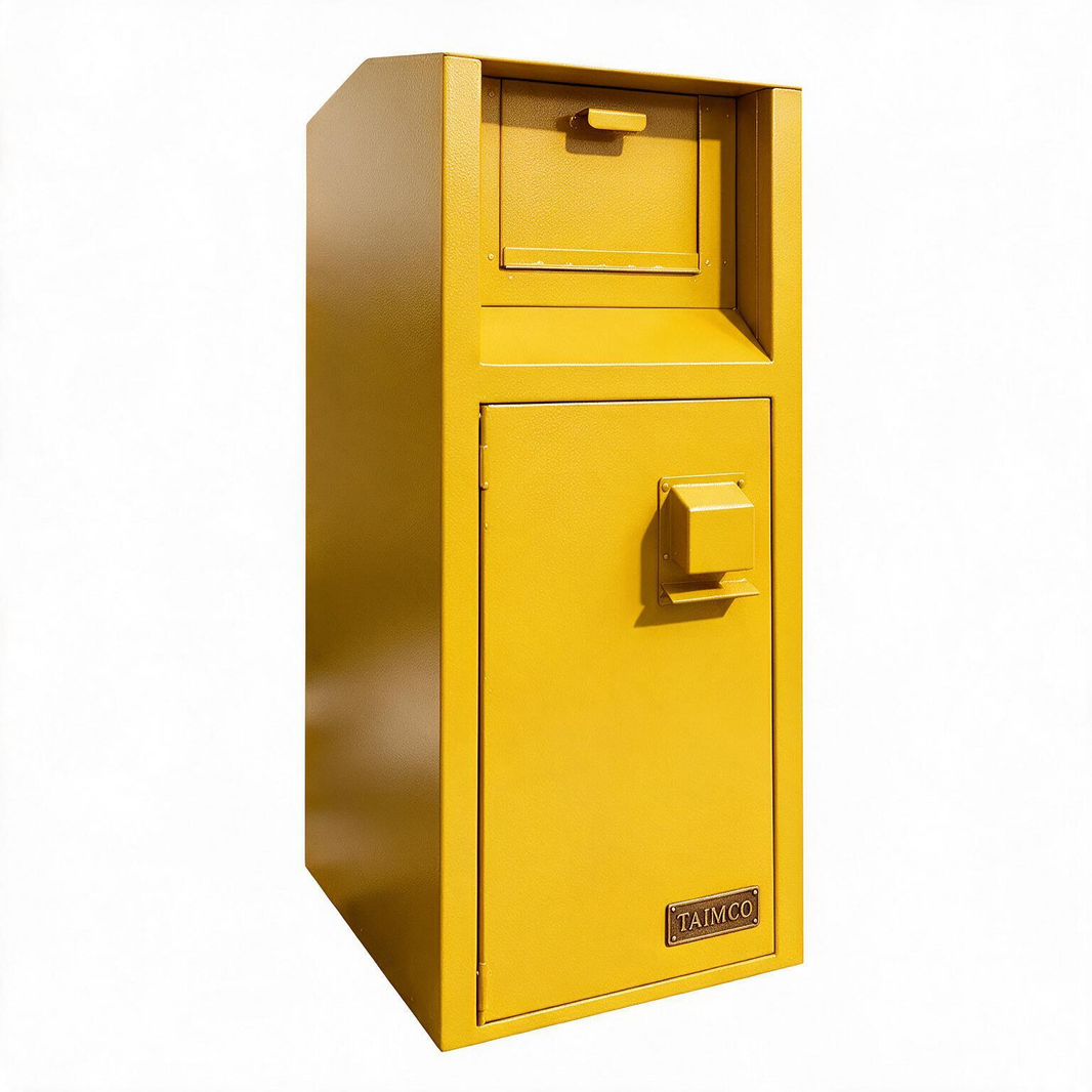 A yellow metal safe with a top drawer and a lower door featuring a handle, photographed on a plain white background. A small plate on the lower right corner reads TAIMCO.