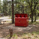 Durable yellow steel enclosure designed with upper ventilation ports and lower storage doors