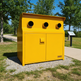 Yellow powder‑coated industrial cabinet with circular top openings and front handle