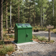Metal double trash enclosure with front access doors and wide loading slots