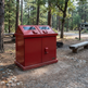 Heavy‑duty steel waste bin featuring two angled deposit openings and dual doors