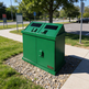 Commercial park waste bin with twin compartments and angled top hoods
