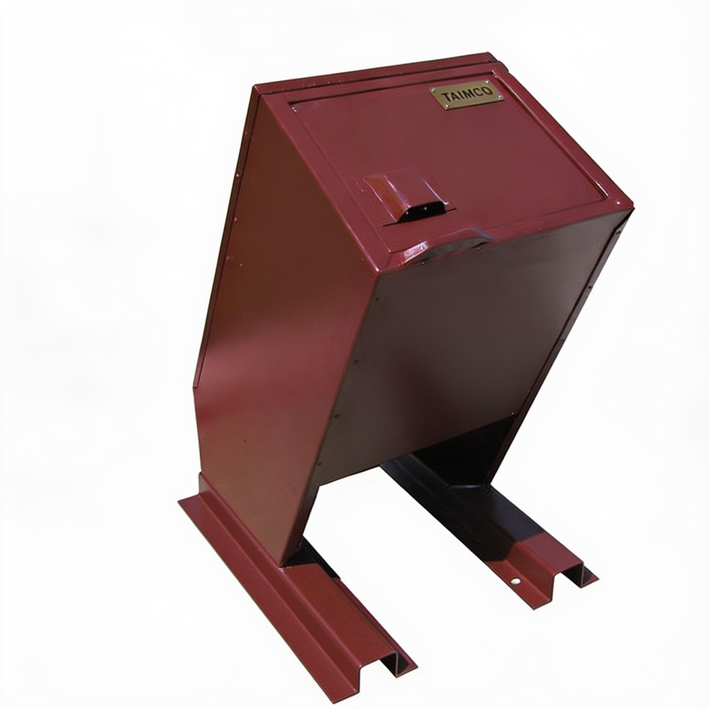 A red metal industrial container or cabinet with a slanted front door, black support legs, and a small brass plate labeled TAMCO, shown on a plain white background.