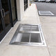 Heavy‑duty aluminum window well grate with expanded‑metal mesh and reinforced frame, designed for basement safety and ventilation.
