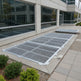 Heavy‑duty aluminum window well grate with expanded‑metal mesh and reinforced frame, designed for basement safety and ventilation.